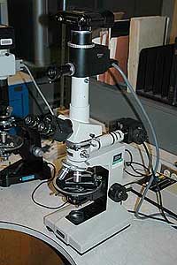 Photo of a mid-1980s Nikon Labophot-Pol polarizing microscope with Nikon film camera.